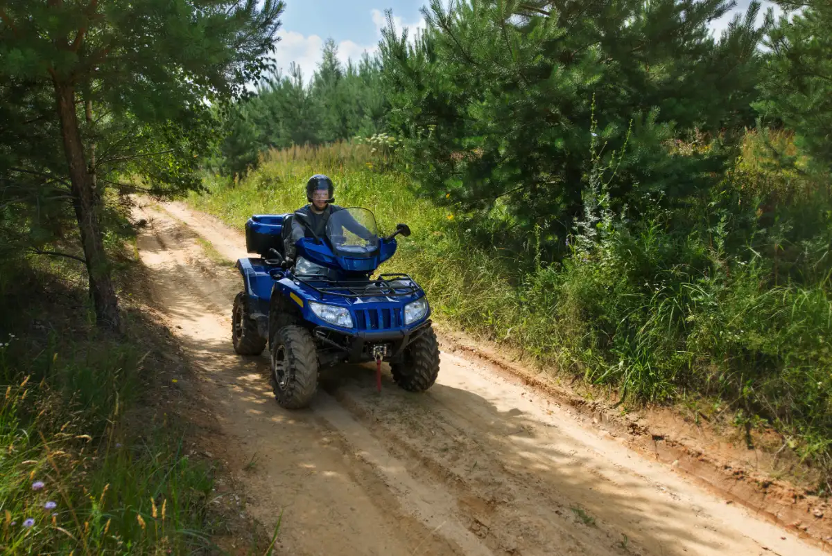 Man On Atv Is Riding Off Road